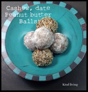 Cashew date peaunt butter balls in a blue bowl