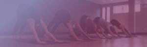 Woman doing downward facing dog - Kind Living - Orillia