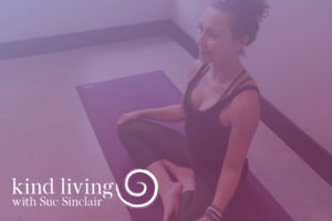 Video Title Image - Woman Sitting Cross Legged on Yoga Mat - Purple Overlay - Kind Living with Sue Sinclair