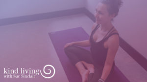 Video Title Image - Woman Sitting Cross Legged on Yoga Mat - Purple Overlay - Kind Living with Sue Sinclair