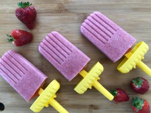 3 Strawberry Chia Creamsicles and strawberries